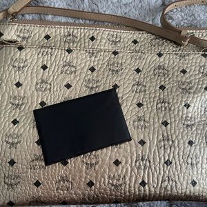 Gold mcm crossbody or pouch